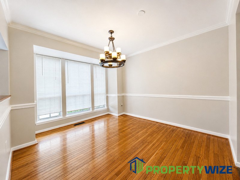 Natural light fills this Woodland Village home! Features garage parking, master suite, updated 2 full baths at top floor and powder room at 1st floor. property image
