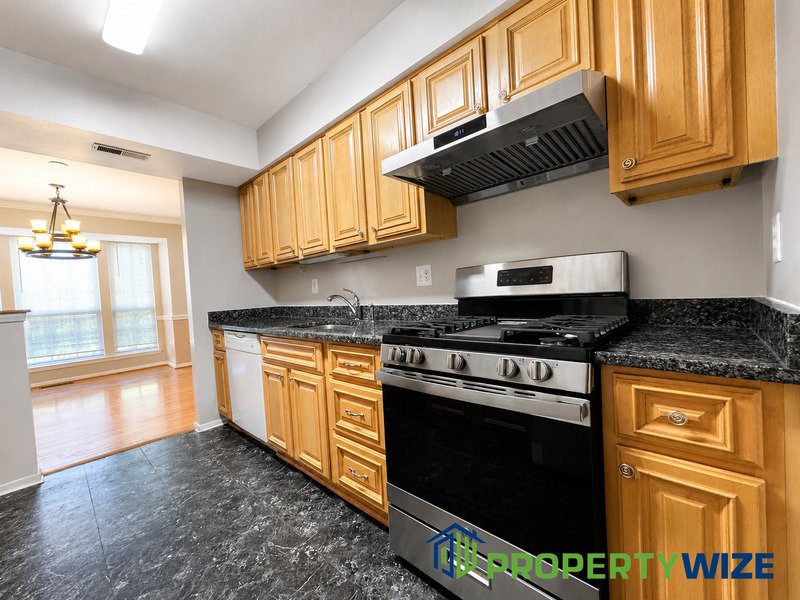 Natural light fills this Woodland Village home! Features garage parking, master suite, updated 2 full baths at top floor and powder room at 1st floor. property image