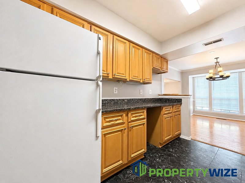 Natural light fills this Woodland Village home! Features garage parking, master suite, updated 2 full baths at top floor and powder room at 1st floor. property image