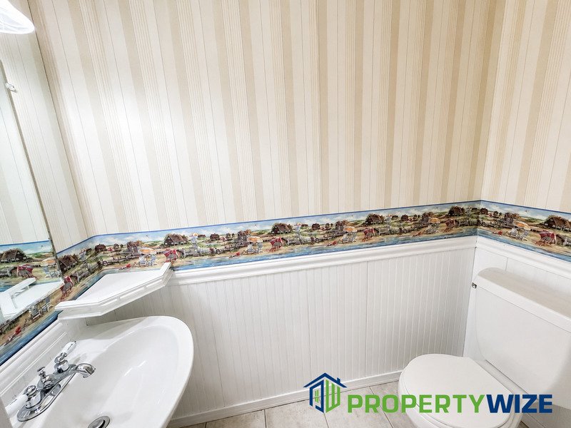 Natural light fills this Woodland Village home! Features garage parking, master suite, updated 2 full baths at top floor and powder room at 1st floor. property image