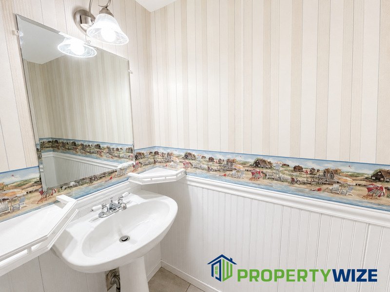 Natural light fills this Woodland Village home! Features garage parking, master suite, updated 2 full baths at top floor and powder room at 1st floor. property image