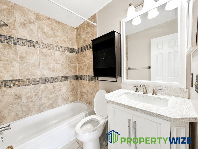 Natural light fills this Woodland Village home! Features garage parking, master suite, updated 2 full baths at top floor and powder room at 1st floor. property image