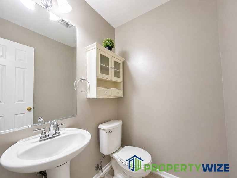 Natural light fills this Woodland Village home! Features garage parking, master suite, updated 2 full baths at top floor and powder room at 1st floor. property image