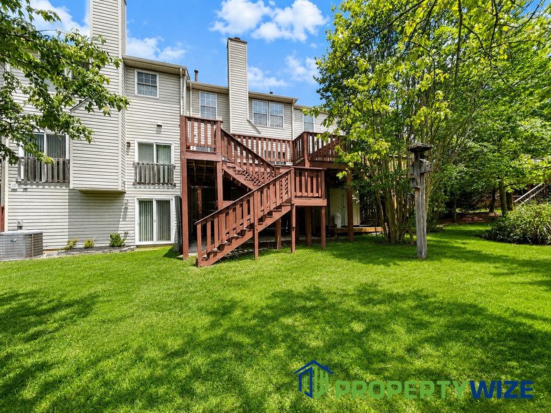 Natural light fills this Woodland Village home! Features garage parking, master suite, updated 2 full baths at top floor and powder room at 1st floor. property image