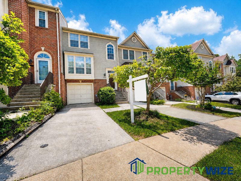 Natural light fills this Woodland Village home! Features garage parking, master suite, updated 2 full baths at top floor and powder room at 1st floor. property image