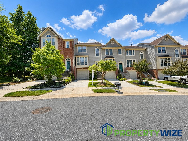 Natural light fills this Woodland Village home! Features garage parking, master suite, updated 2 full baths at top floor and powder room at 1st floor. property image